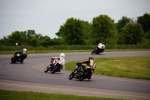 Gingerman 4 motorcycles racing away